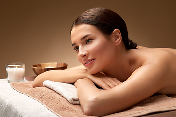 Image showing young woman lying at spa or massage parlor