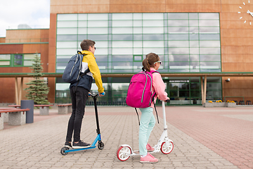 Image showing school children with backpacks and scooters