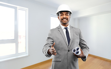 Image showing male architect in helmet giving hand for handshake