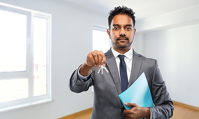 Image showing indian man realtor with home keys and folder