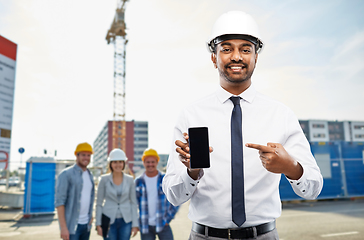 Image showing architect showing smartphone at construction site