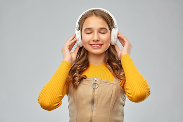 Image showing teenage girl in headphones listening to music