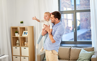 Image showing father with little baby daughter at home