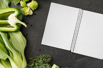 Image showing green vegetables and diary with empty pages