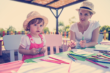 Image showing mom and little daughter drawing a colorful pictures