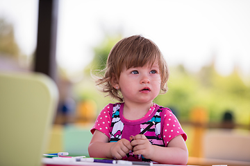 Image showing little girl drawing a colorful pictures