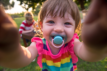 Image showing little girl spending time at backyard