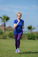 Image showing young female runner training for marathon