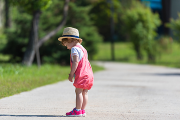 Image showing little girl runing in the summer Park