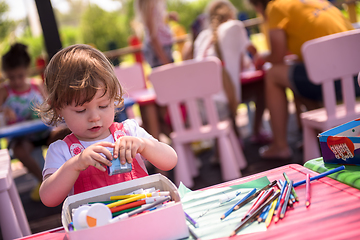 Image showing little girl drawing a colorful pictures