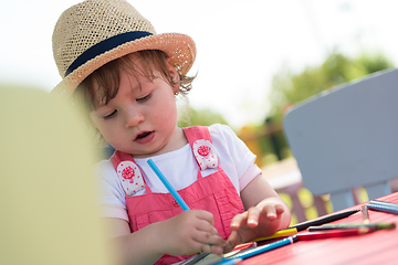 Image showing little girl drawing a colorful pictures