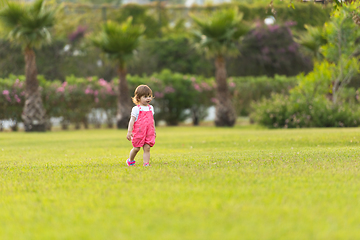 Image showing little girl spending time at backyard