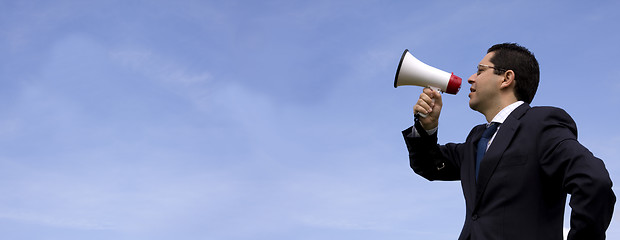 Image showing Businessman speaking with a megaphone
