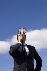 Image showing Businessman speaking with a megaphone