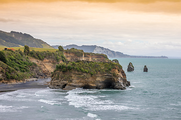 Image showing sea shore rocks and mount Taranaki, New Zealand