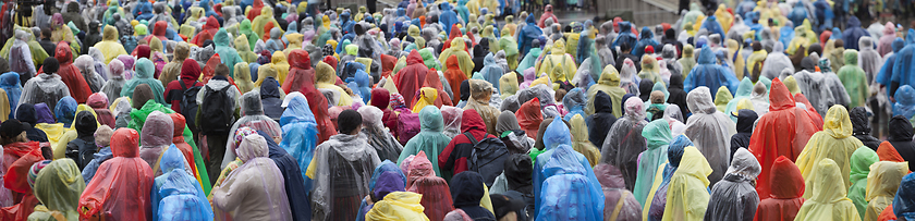 Image showing Crowd in colorful raincoats