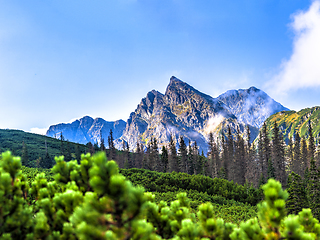 Image showing Polish Tatra mountains summer landscape with blue sky and white clouds.