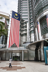 Image showing Large Malaysian flag on Petronas Twin Towers facade.