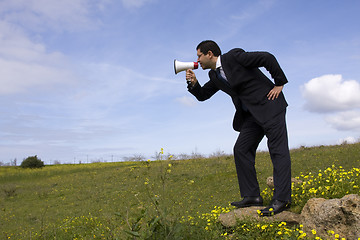 Image showing Businessman speaking with a megaphone