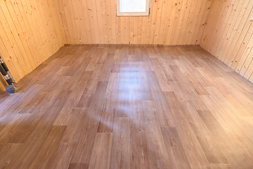 Image showing Linoleum laid on the floor in a small room of a country house