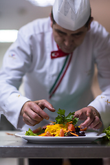 Image showing chef serving vegetable salad