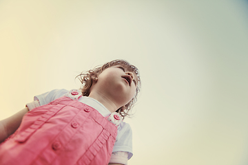 Image showing little girl spending time at backyard