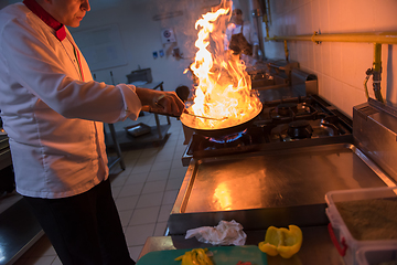 Image showing Chef doing flambe on food