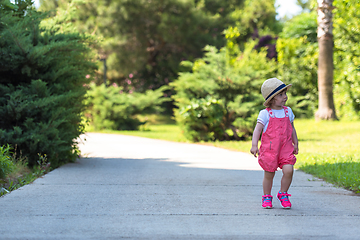 Image showing little girl runing in the summer Park