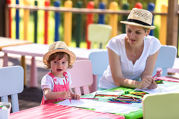 Image showing mom and little daughter drawing a colorful pictures