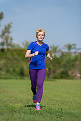 Image showing young female runner training for marathon