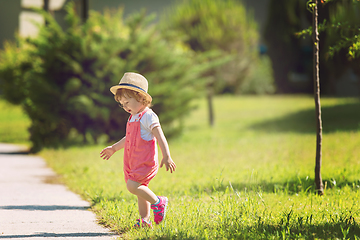 Image showing little girl runing in the summer Park