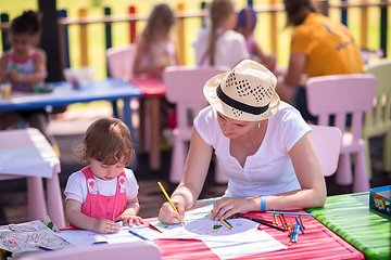 Image showing mom and little daughter drawing a colorful pictures