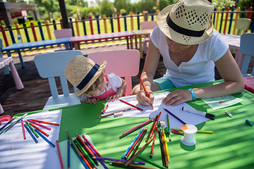 Image showing mom and little daughter drawing a colorful pictures