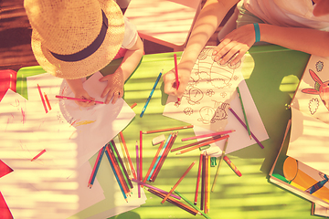 Image showing mom and little daughter drawing a colorful pictures