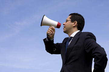 Image showing Businessman speaking with a megaphone