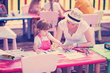 Image showing mom and little daughter drawing a colorful pictures