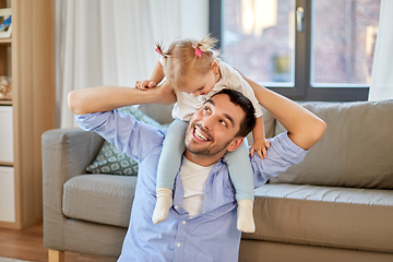 Image showing father riding little baby daughter on neck at home