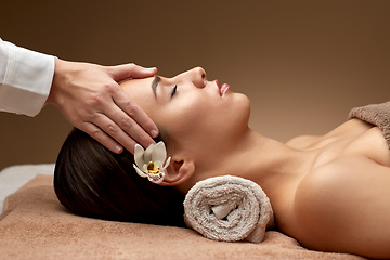 Image showing woman having face and head massage at spa