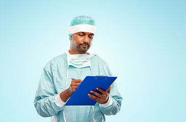 Image showing indian male doctor or surgeon with clipboard