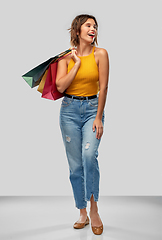 Image showing happy smiling young woman with shopping bags