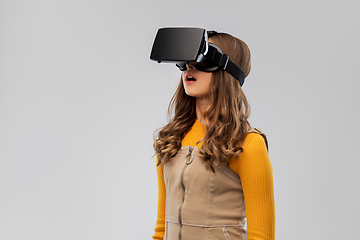 Image showing teenage girl in vr glasses over grey background