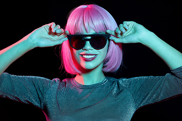 Image showing happy woman in pink wig and black sunglasses