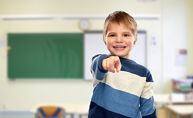 Image showing little boy pointing finger at school