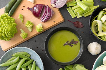 Image showing green vegetables and cream soup in ceramic bowl