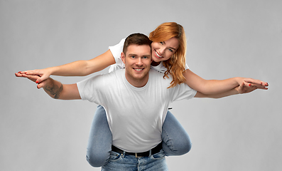 Image showing happy couple in white t-shirts having fun