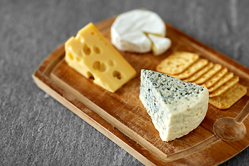 Image showing close up of blue cheese on wooden cutting board