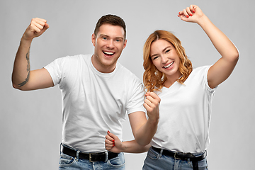 Image showing portrait of happy couple in white t-shirts