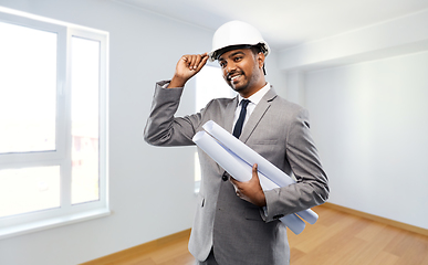 Image showing indian male architect in helmet with blueprints