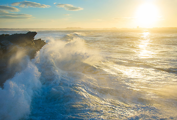 Image showing Ocean rocky beach at sunset