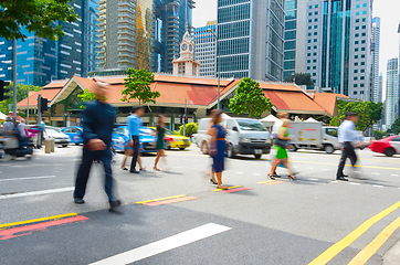 Image showing Motioned people crossing road Singapore 